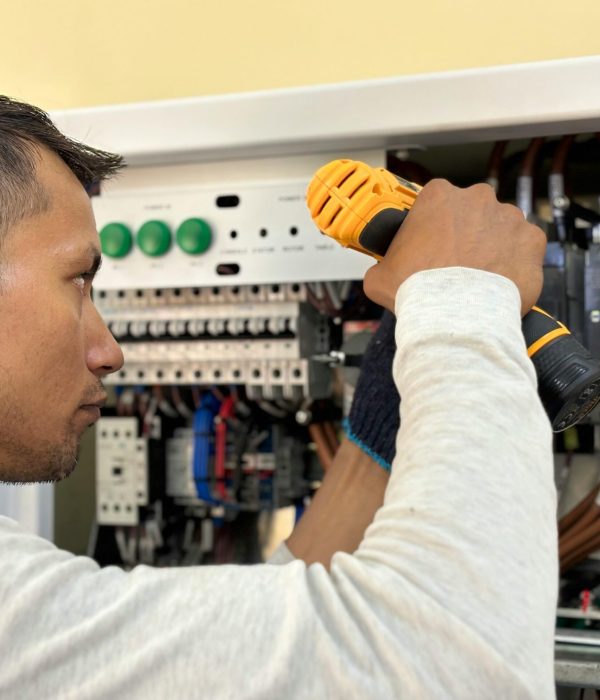 Licensed electrician working on residential electrical panel in the Bronx, NY